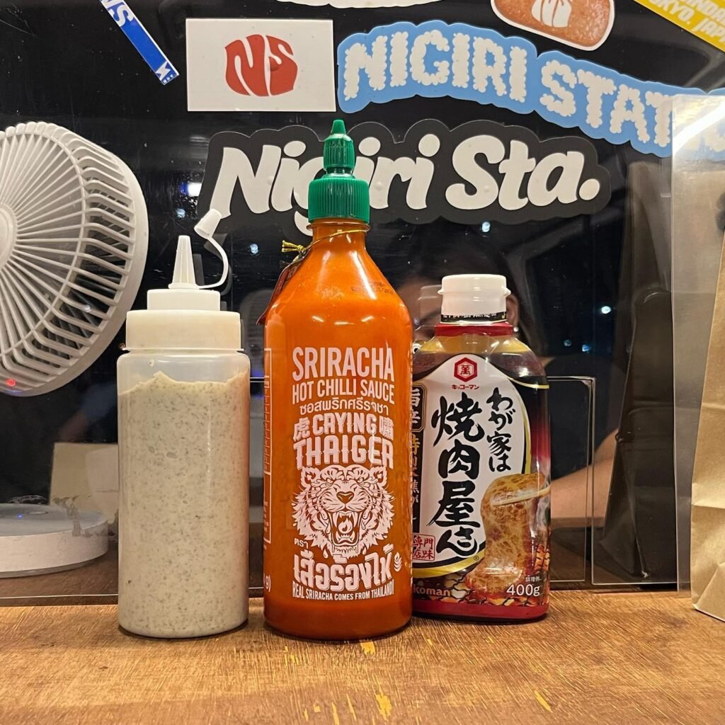 Crying Thaiger Sauce, Yakiniku Sauce, and a house blend sauce side by side.