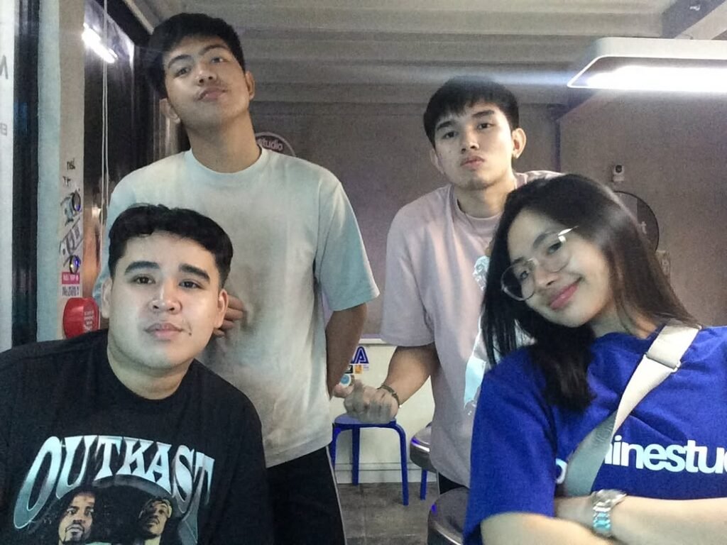 customerr A group of four friends at Nigiri Station Pampanga, posing in a casual late-night eatery, enjoying a relaxed urban dining experience.