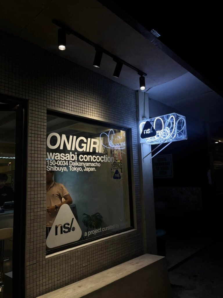 nigiri Nigiri Station Experience: Warmly lit entrance at night