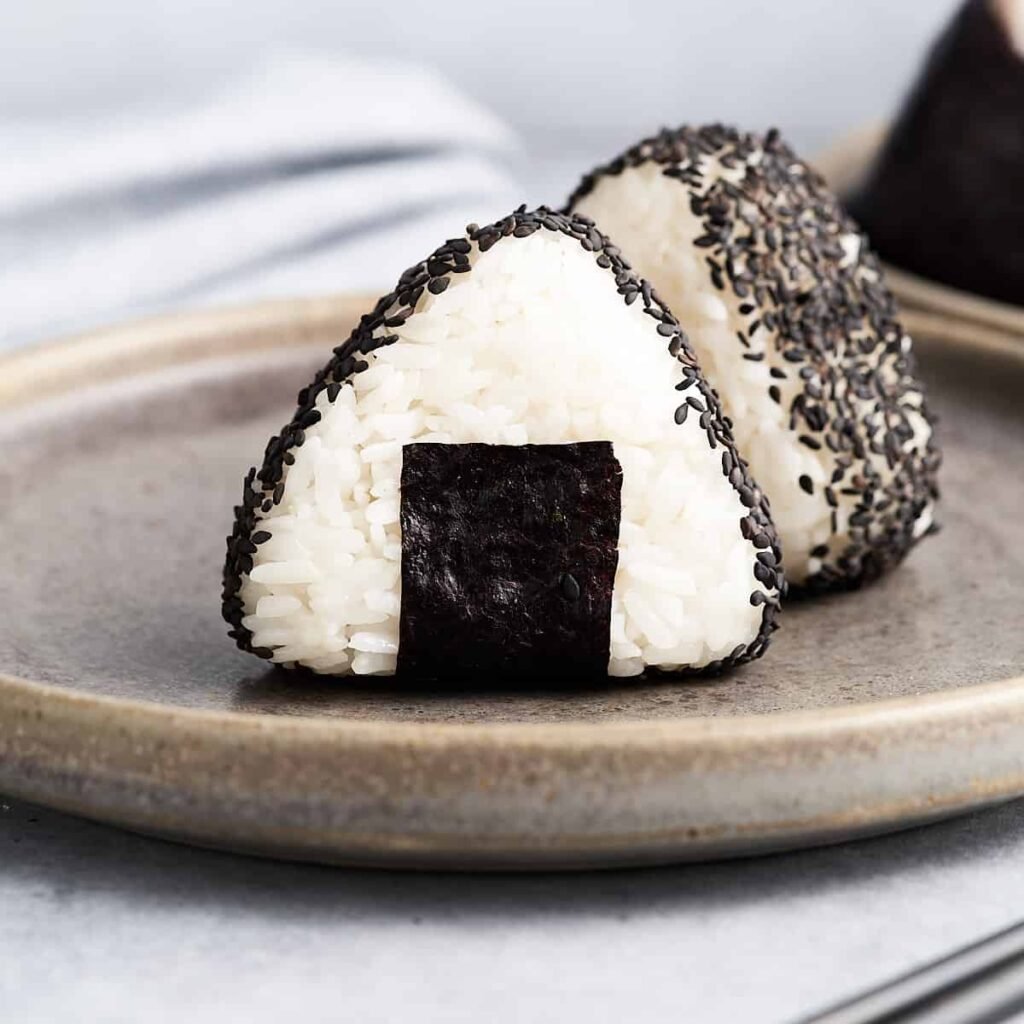 Sushi, Nigiri, and Onigiri: Onigiri with black sesame seeds